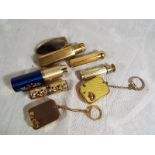 A good mixed lot to include four pocket atomisers, a pocket lipstick holder with compact mirror and