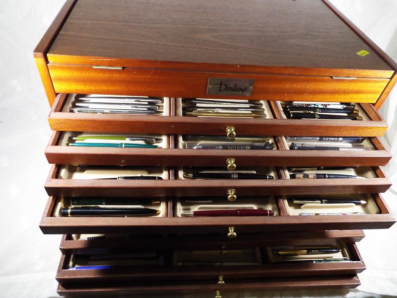 A cabinet marked Darlena comprising nine drawers containing approximately 300 contemporary pens,