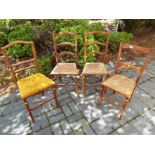 Four Edwardian chairs of which three with strung seats