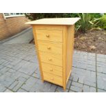 A good modern light wood chest of five graduated drawers retailed by Marks & Spencer, ca July 2012,