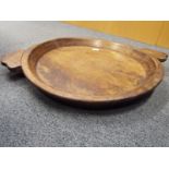 A large hand carved wooden plater / mixing tray 7cm (h) x 74cm (diam)