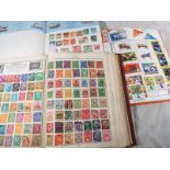 Philately - three albums of early 20th century UK and World postage stamps and a box of first day