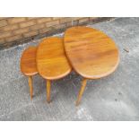 An Ercol nest of three tables in elm and beech designed by Lucian R Erolani - Est £80 - £120