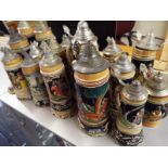 Seventeen steins, some with musical movements