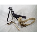 A pair of opera glasses with mother of pearl mounts and handle, a small tripod with case and a