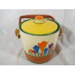 A Clarice Cliff lidded biscuit barrel decorated in the Crocus pattern with swing handle, 16cm (h) x
