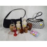 Two lady's designer handbags, five stoneware bottles, an etched red glass perfume bottle with