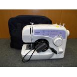 A Brother sewing machine, model XL2620, with soft case and pedal