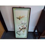 An Oriental 3D carved shell picture depicting birds, mounted and framed under glass, image size