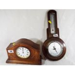 An early 20th century wooden cased mantel clock, Roman numerals on a white dial, wind-up movement,