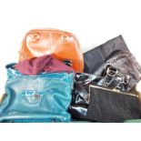 A collection of lady's handbags to include Mountain Stone, a Charlie Larson, evening bags and