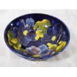 A Moorcroft pottery large pedestal bowl patterned inside and out with Hibiscus on a cobalt blue