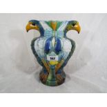 A vase in the form of two eagles with twin beak handles, 21cm (h)