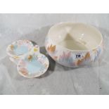 A Clarice Cliff pedestal bowl decorated with leaves and berries and a trinket dish of a similar