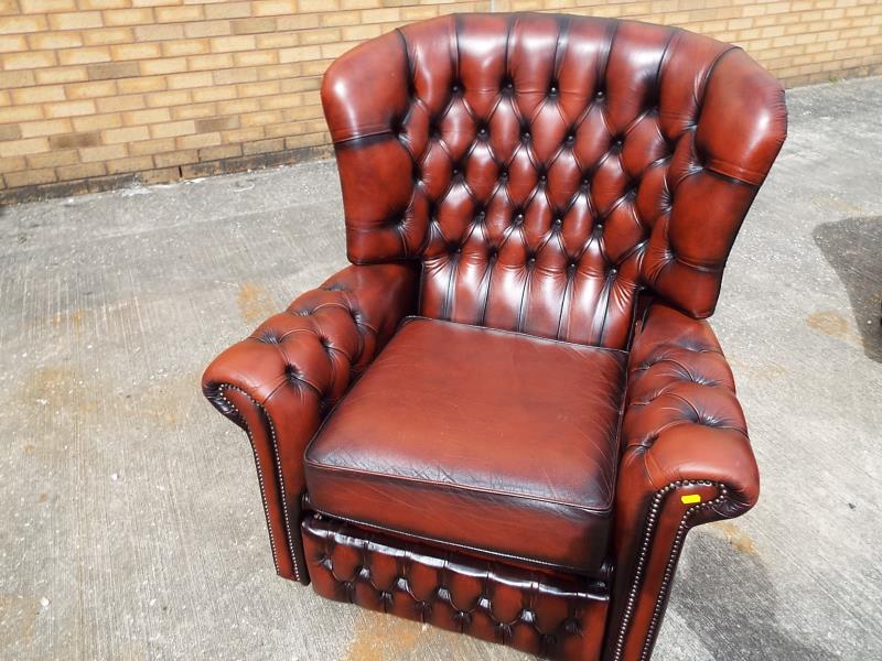 A good quality button-back, reclining leather armchair