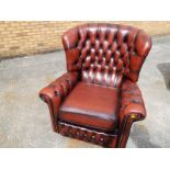 A good quality button-back, reclining leather armchair