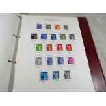 A Stanley Gibbons country stamp album containing a collection of predominately UK mint stamps with