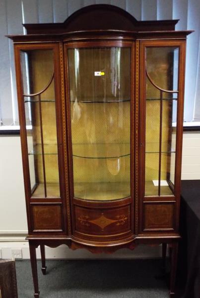 A good early period display cabinet, the central bow-fronted panel flanked by twin doors, glazed