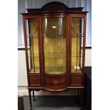 A good early period display cabinet, the central bow-fronted panel flanked by twin doors, glazed