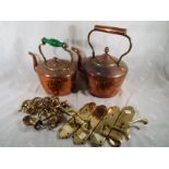 Two copper kettles and a small quantity of brass door furniture