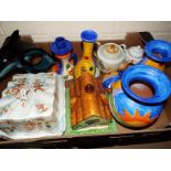 Two boxes to include a Beswick pottery cottage, Poole Pottery dolphin, Gran Canaria pottery, cheese
