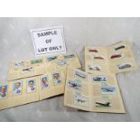 A collection of 16 cigarette card albums of various subjects to include football, motor cars, Royal