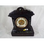 A French black and green marble mantel clock, incised gilded decoration, white chapter ring with