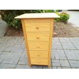 A good modern light wood chest of five graduated drawers retailed by Marks & Spencer, ca July 2012,