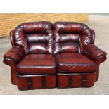 A good quality two-seater reclining leather sofa