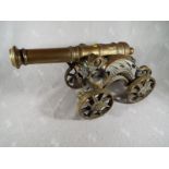 A good ornamental brass cannon, 24cm (h) x 45cm (l) - Est £50 - £80