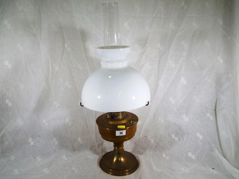 An Aladdin No. 23 brass oil lamp with funnel and shade, approximately 60cm (h)