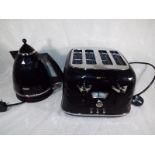 Ex-Display - A Delonghi four slice toaster with matching kettle in black