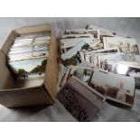 Approx 450 early to mid period postcards including real photographs, street scenes interest in