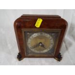 An Art Deco styled mantel clock, the case in walnut veneer, marked Boodle and Dunthorne, Liverpool,