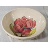 A Moorcroft pottery pedestal bowl decorated with pink magnolia on an ivorine ground, 7cm (h) x 16cm