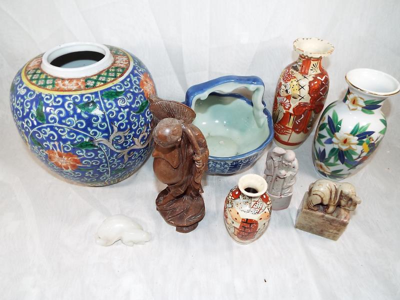 A good mixed lot of Oriental ware to include three hard stone carved figures, a wooden carved