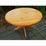 A pine kitchen table, 73cm (h) x 107cm (diam)