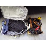 A good quality micro fibre suitcase containing a collection of quality clothing to include Viyella,