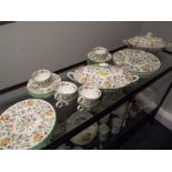 A Minton dinner service decorated in the Haddon Hall pattern comprising 34 pieces to include two