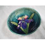 Moorcroft Pottery - A small pedestal bowl decorated with an orchid on a green ground, 5cm (h) x