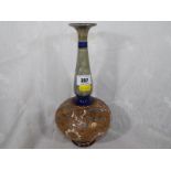 A Royal Doulton stoneware vase with relief decoration and gilded highlights 27cm (h)
