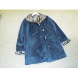 A lady's good quality reversible jacket 90 cm (l), teal coloured