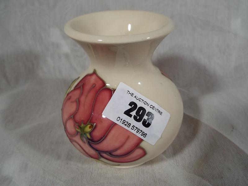 Moorcroft Pottery - A vase decorated with pink magnolia on an ivorine ground, 9cm (h) - Est £40 -