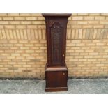 A carved oak long case cabinet converted to form a plant stand 153 cm (h)