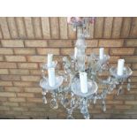 A six arm crystal chandelier