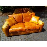 A good quality leather 2 seater sofa, light tan, 80 cm (h) x 200 cm (w) x 100 cm (d)