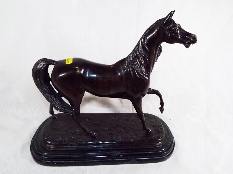 A hot cast bronze depicting a horse, mounted on an Italian marble plinth, signed (unclear), 30cm