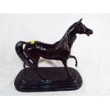 A hot cast bronze depicting a horse, mounted on an Italian marble plinth, signed (unclear), 30cm