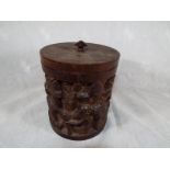 A wooden highly carved caddy 14cm (h)