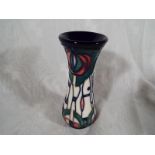 Moorcroft Pottery - A baluster vase decorated in a floral design, 13cm (h) - Est £60 - £80